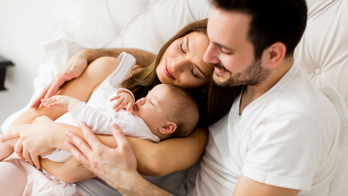 Happy family with newborn baby