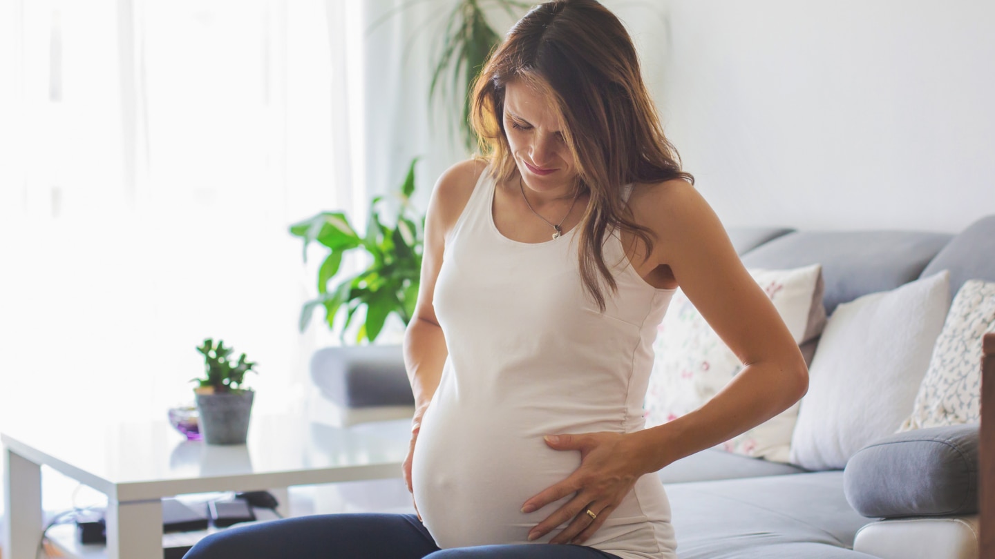 Young pregnant woman, having painful contraction