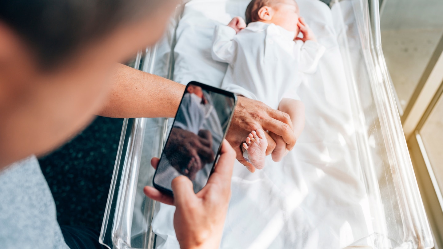 Father takes photo of son