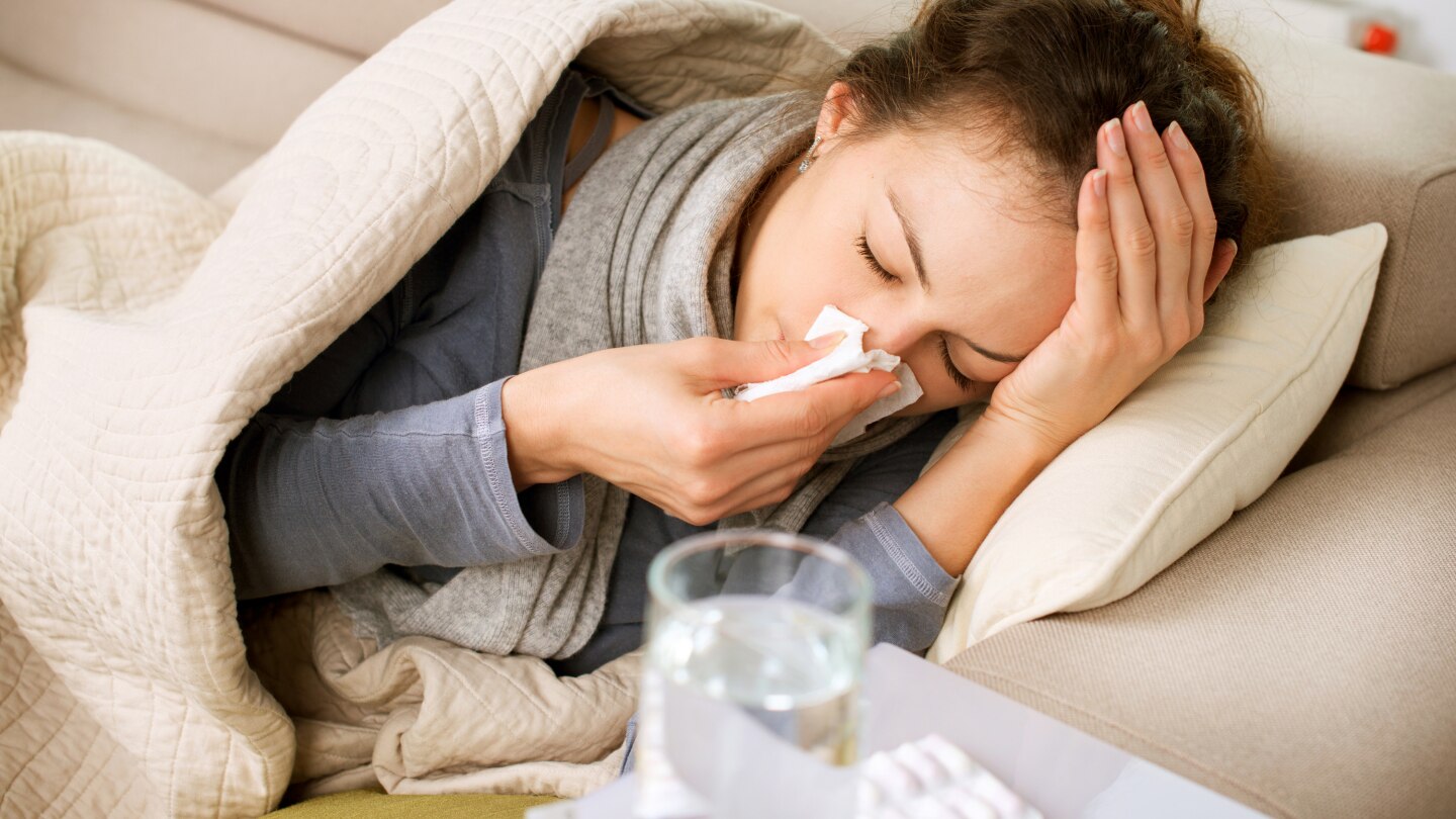 sick woman lying on the sofa