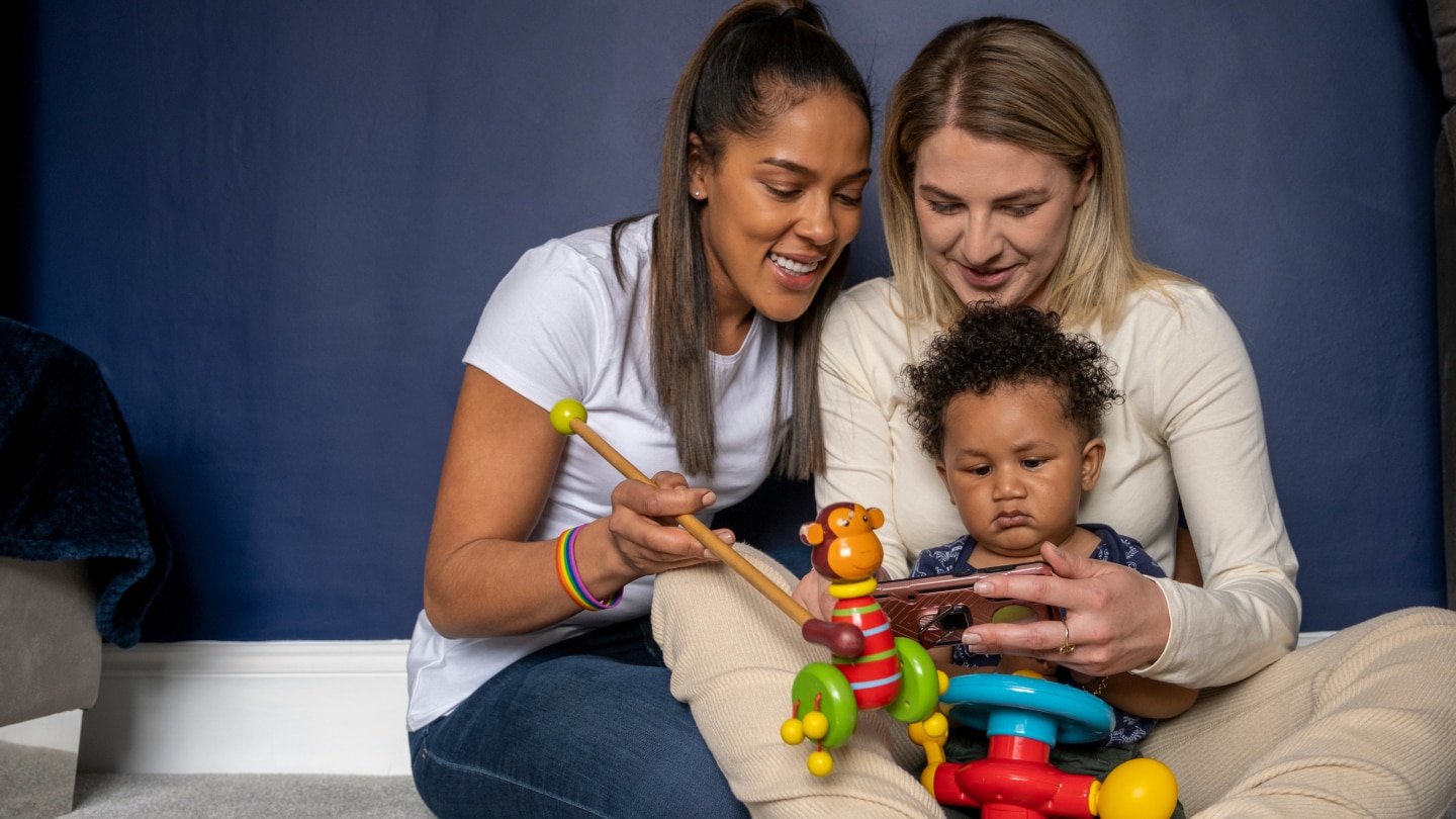 Mothers playing with baby son