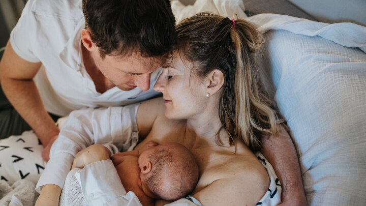 Happy family with newborn baby