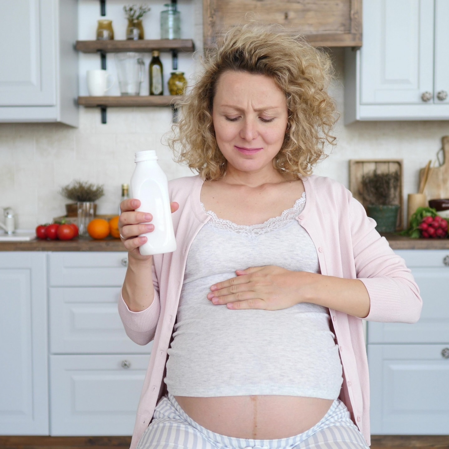 Pregnant Woman Taking Medicine Against Heartburn