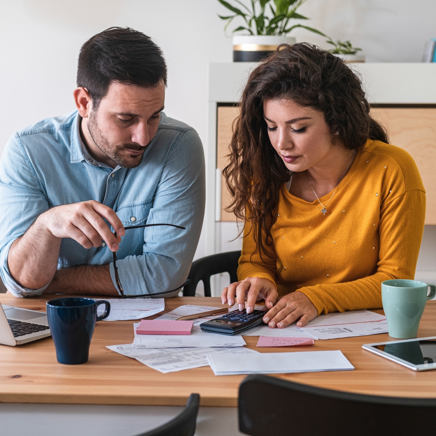 Young couple calculating their domestic bills