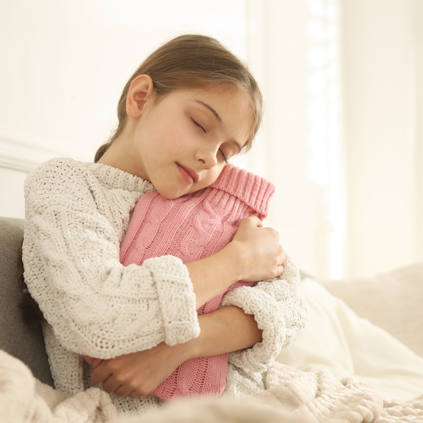 Mädchen mit Wärmflasche