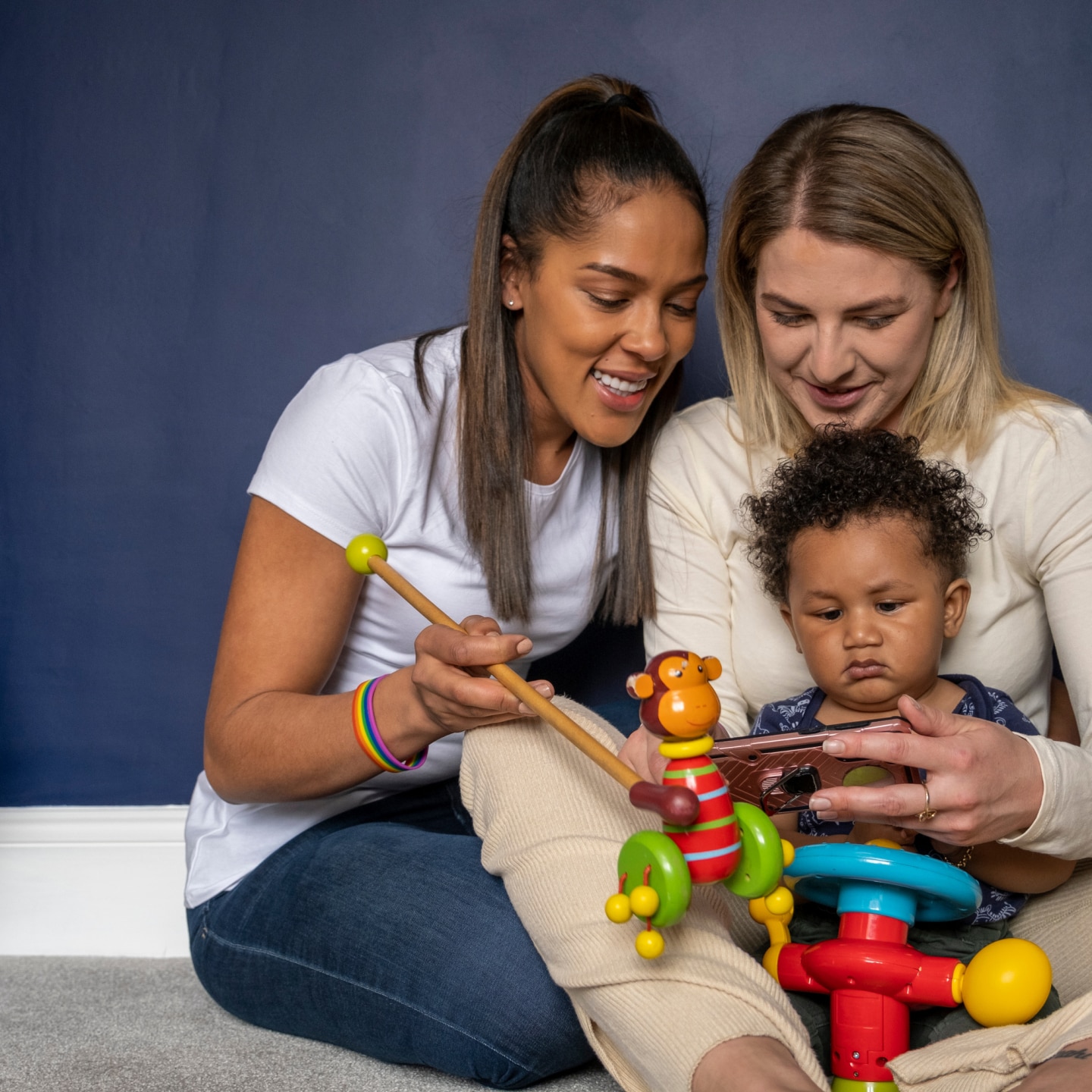 Mothers playing with baby son