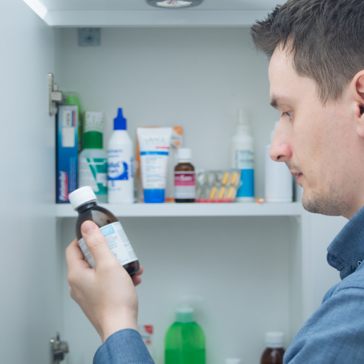 Man hold medication bottle