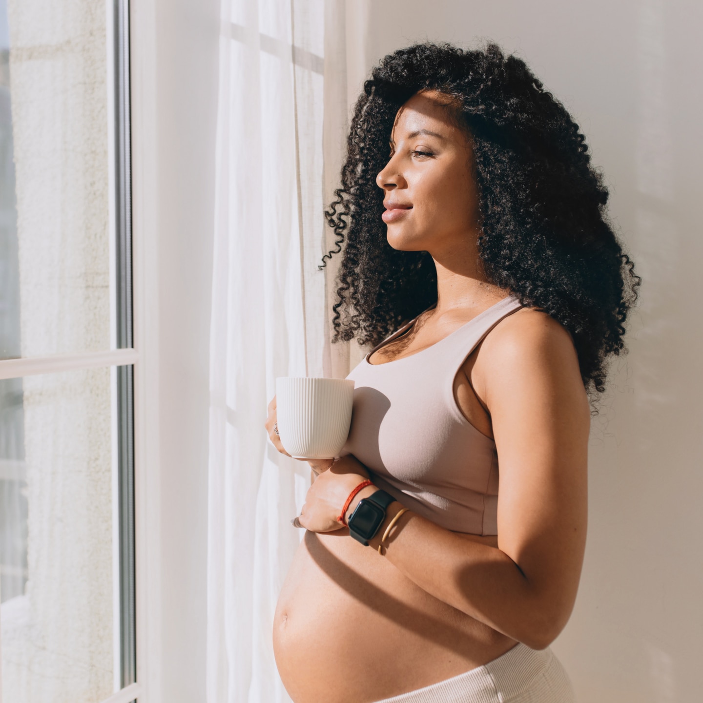 pregnant woman drinking coffee